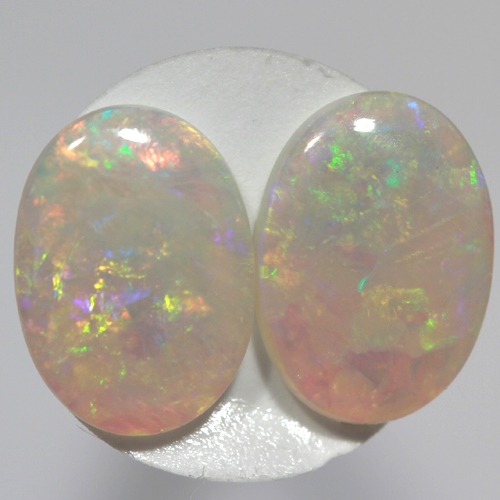 SOLID SEMI BLACK OPALS Matching pair, bright green and orange